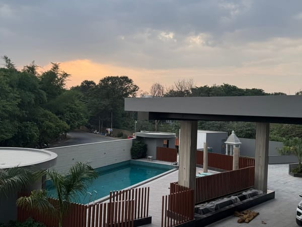 Outdoor swimming pool and poolside pergola at RG Grand Hotel & Convention, Bengaluru