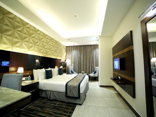 Deluxe room with king bed at RG Royal Hotel & Convention, Bengaluru