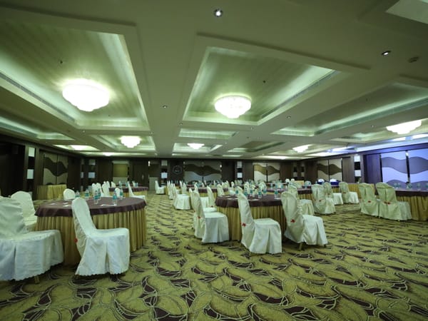 Banquet hall at RG Royal Hotel and Convention, Bengaluru set up for a corporate conference