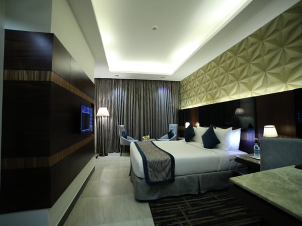 Well-appointed guest room at RG Royal Hotel & Convention, Bengaluru