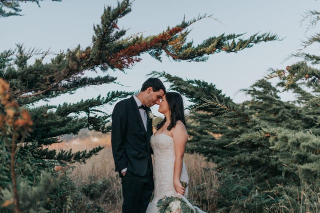 A couple sharing an intimate moment in nature near Brewery Gulch Inn