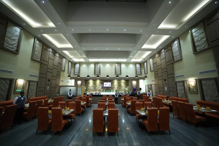 Maxims multi-cuisine restaurant at RG Royal Hotel, Bengaluru