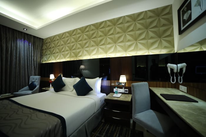 Deluxe guest room at RG Royal Hotel, Bengaluru