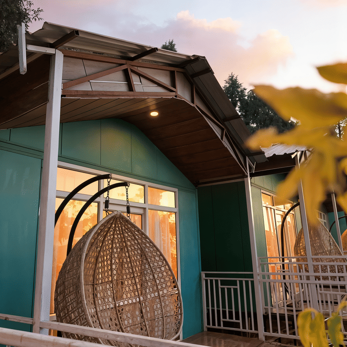 Nazaara Nature Retreat, Dalhousie, cottage porch seating at dusk