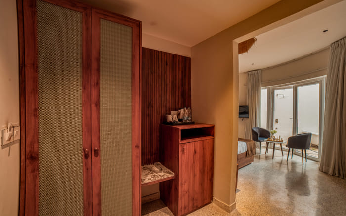 Wardrobe and minibar nook in the Luxurious Cabana Cottage at Nazaara Hills Retreat, Udaipur.
