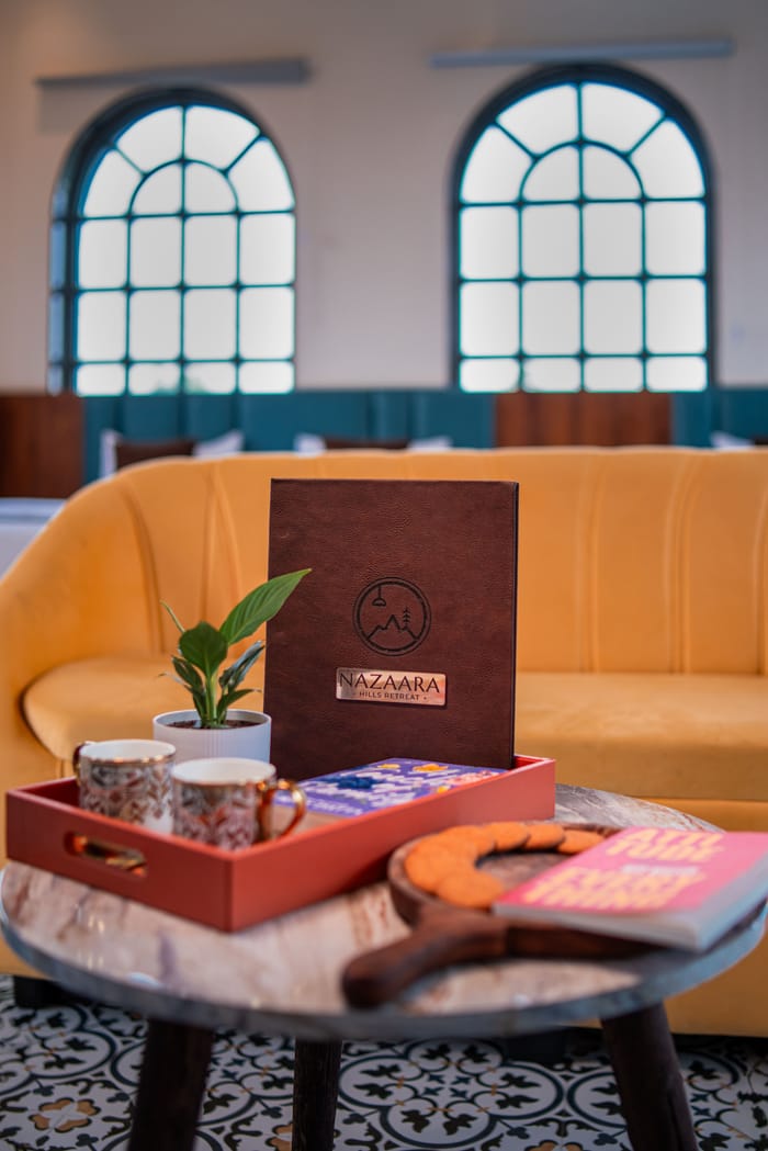 Welcome tray set out in the lounge area of the Nazaara Family Suite at Nazaara Hills Retreat, Udaipur.