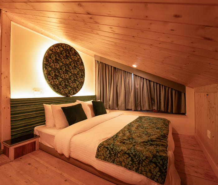 Close-up of the bed headboard in the Nazaara Luxe Duplex room at Nazaara Luxe Retreat, Manali