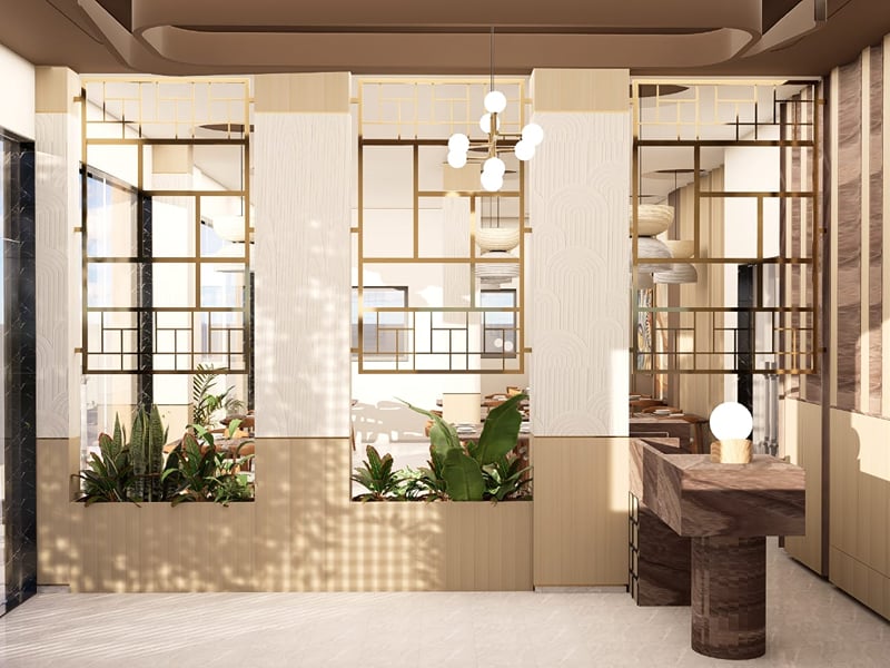 Reception with a stone desk, planters, and daylight through the glass entrance | Shirgaonkar Beach Resort