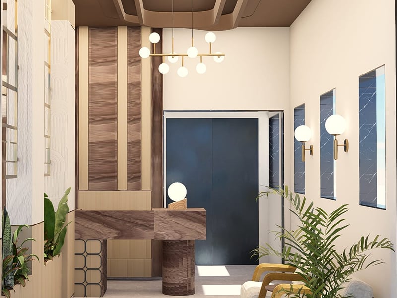 Reception with a marble-topped desk, globe pendant lights, and lounge chairs | Shirgaonkar Beach Resort