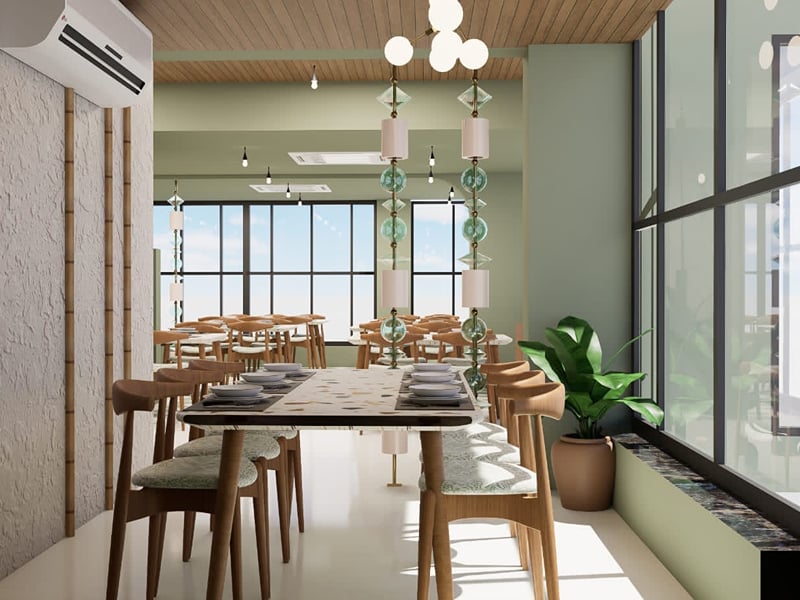 First-floor seating along a long shared table beside tall windows | Shirgaonkar Beach Resort