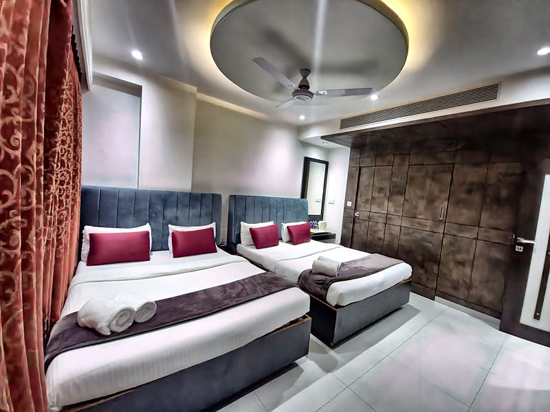 Presidential Suite beds beside the wardrobe wall