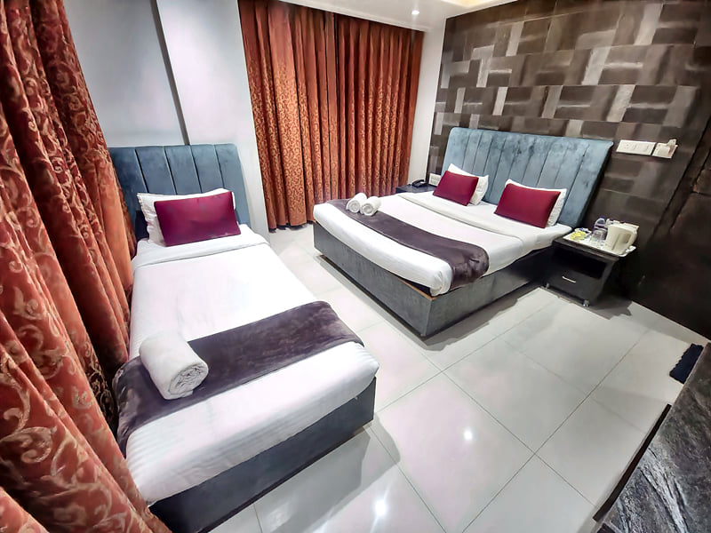 Presidential Suite single bed with a double bed beyond