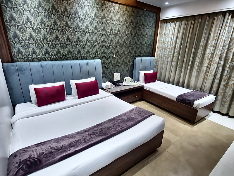 Privilege Triple Club Room double bed with the single bed beyond