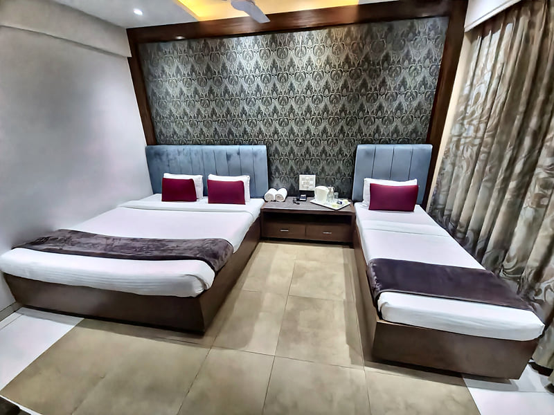 Privilege Triple Club Room with a double bed and a single bed