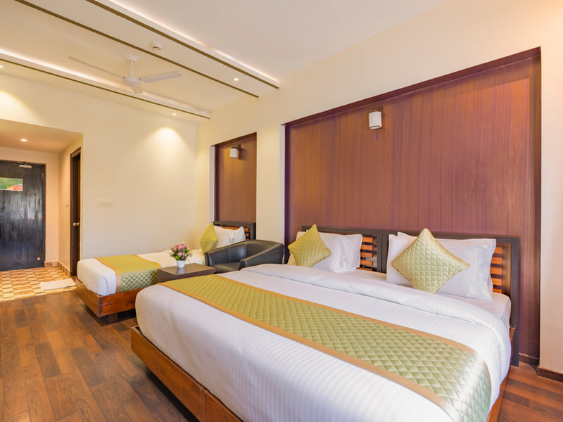 Executive Twin Room with two beds and a wood-panelled wall
