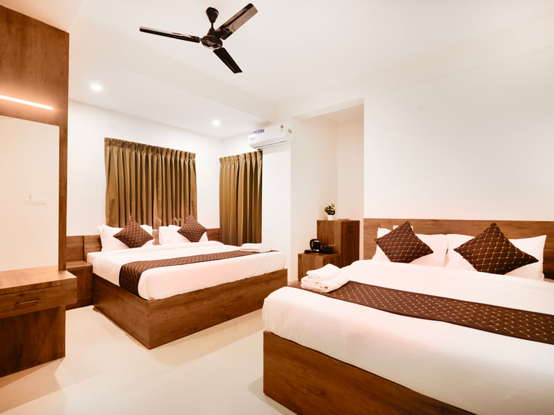 Executive Family Room with two queen beds and curtained windows