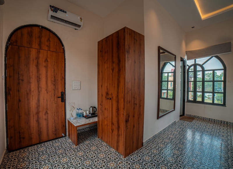 The wardrobe and minibar nook in the Nazaara Family Suite at Nazaara Hills Retreat, Udaipur.