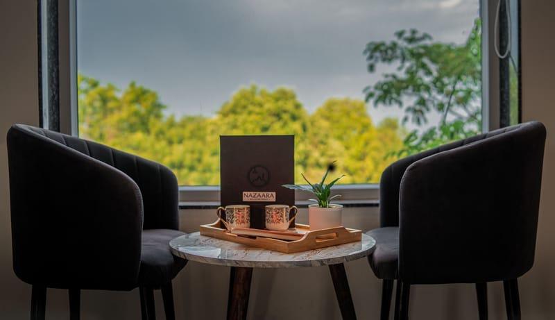 A window seating nook in the Nazaara Royal Suite at Nazaara Hills Retreat, Udaipur.