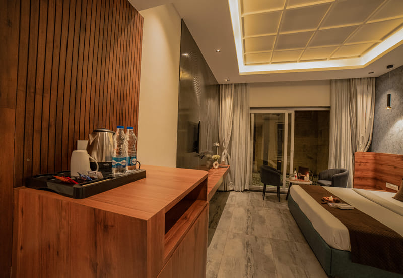 The tea and coffee station in the Premium Plunge Pool Room at Nazaara Hills Retreat, Udaipur.