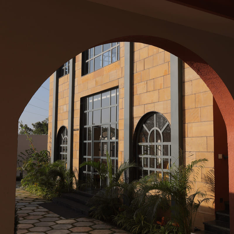 Archway entrance to the reception at Nazaara Hills Retreat, Udaipur, seen from outside