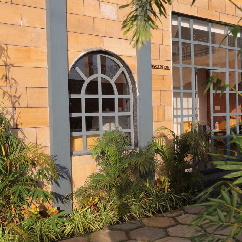 The reception entrance and signage facade at Nazaara Hills Retreat, Udaipur.