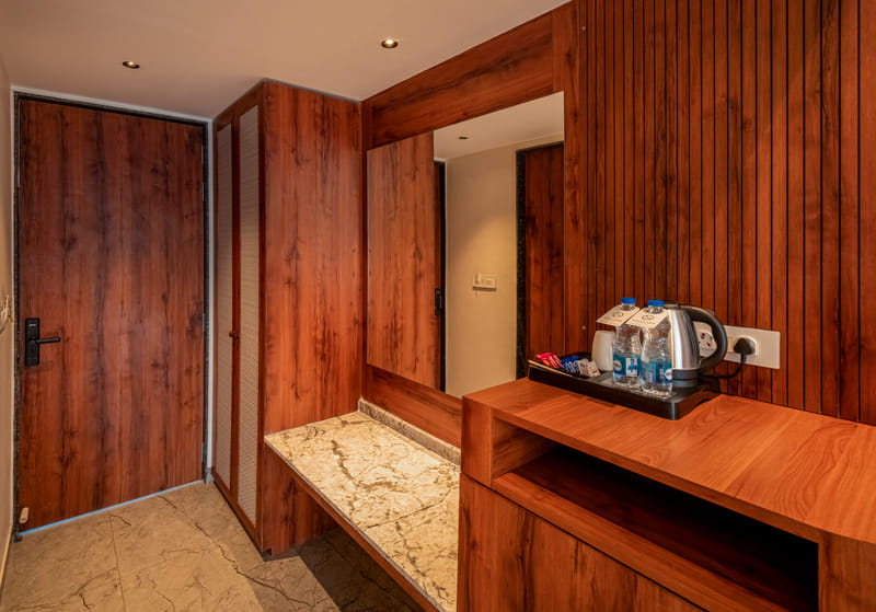 The wardrobe and tea and coffee station in the Superior Room at Nazaara Hills Retreat, Udaipur.