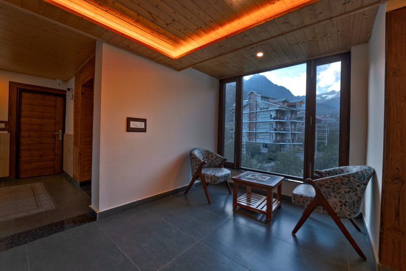 Corridor seating at Nazaara Luxe Retreat overlooking the town view outside