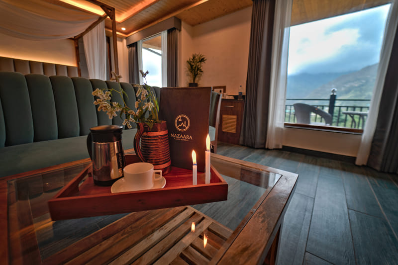 A room service menu laid out at Nazaara Luxe Retreat