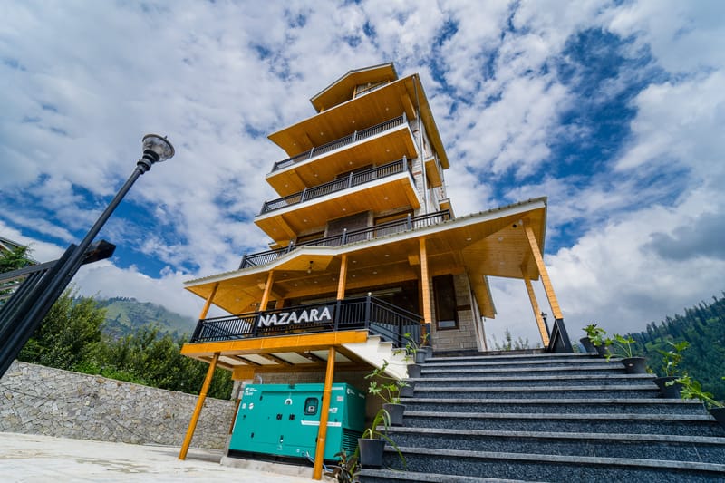 Entrance signage and stairway leading up to Nazaara Luxe Retreat's main building