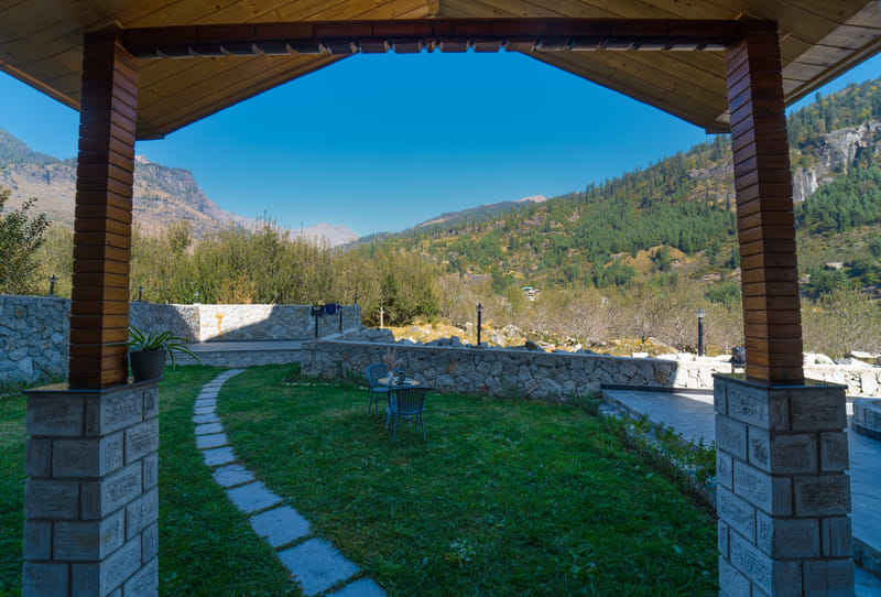 Gazebo seating on the lawn at Nazaara Luxe Retreat, facing an open view of the surrounding mountains