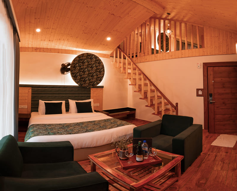 Two-level layout of the Nazaara Luxe Duplex room at Nazaara Luxe Retreat, with a loft bedroom above the lounge