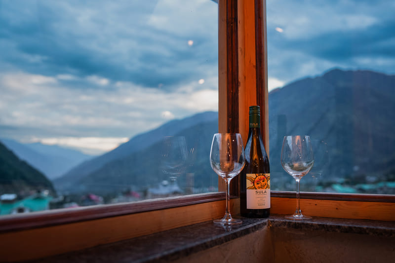 Two glasses set on the windowsill of the Nazaara Luxe Interconnected room at Nazaara Luxe Retreat