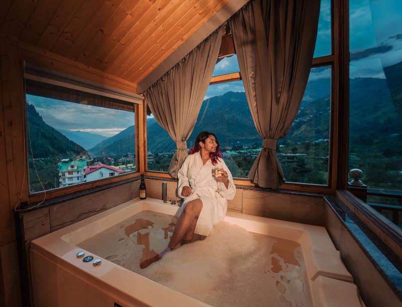 A guest in a bathrobe in the Nazaara Luxe Interconnected room at Nazaara Luxe Retreat