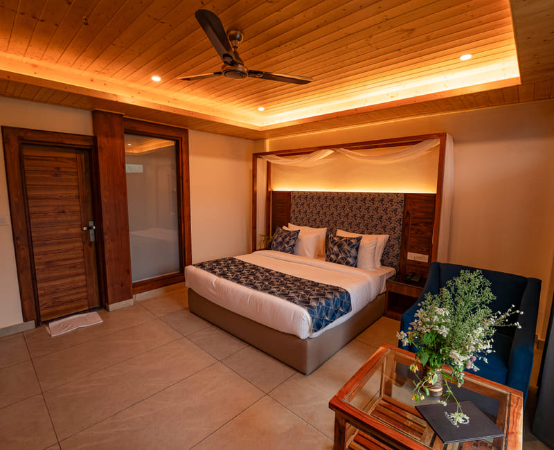 A canopy bed interior view in one of the rooms at Nazaara Luxe Retreat