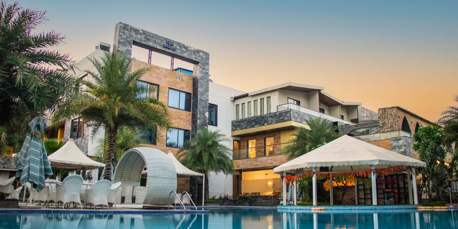 The pool deck and cabanas at golden hour