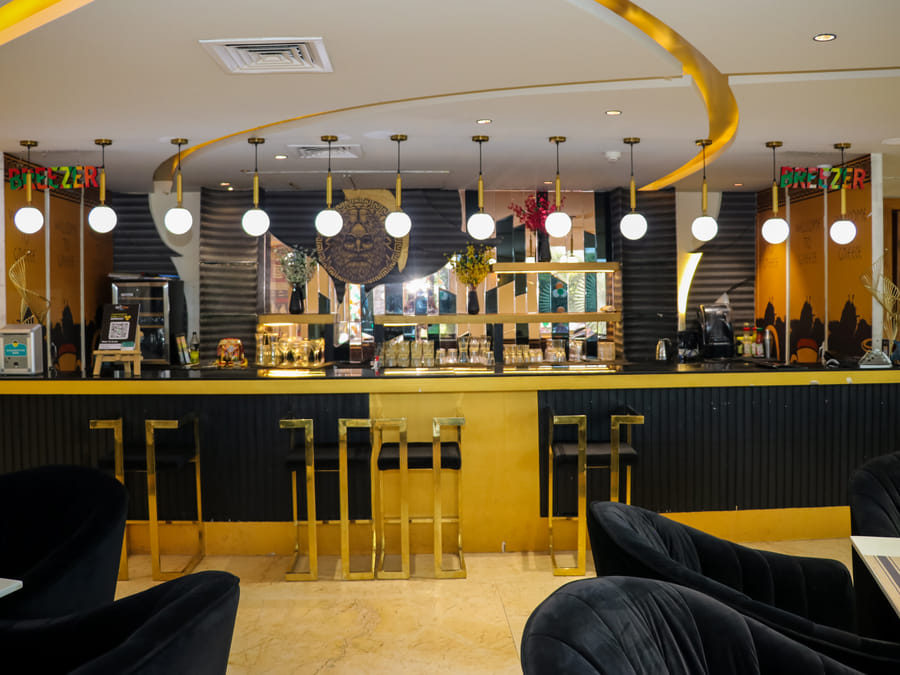 Skyline by Miraya, Zeus, The gold and black bar at Zeus