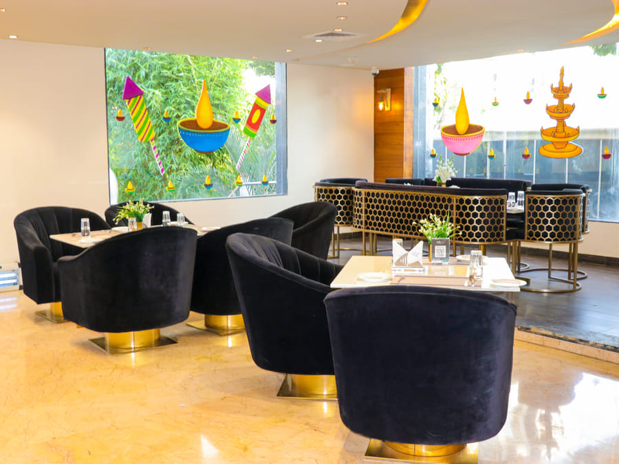 Skyline by Miraya, Zeus, Window seating beside the painted glass