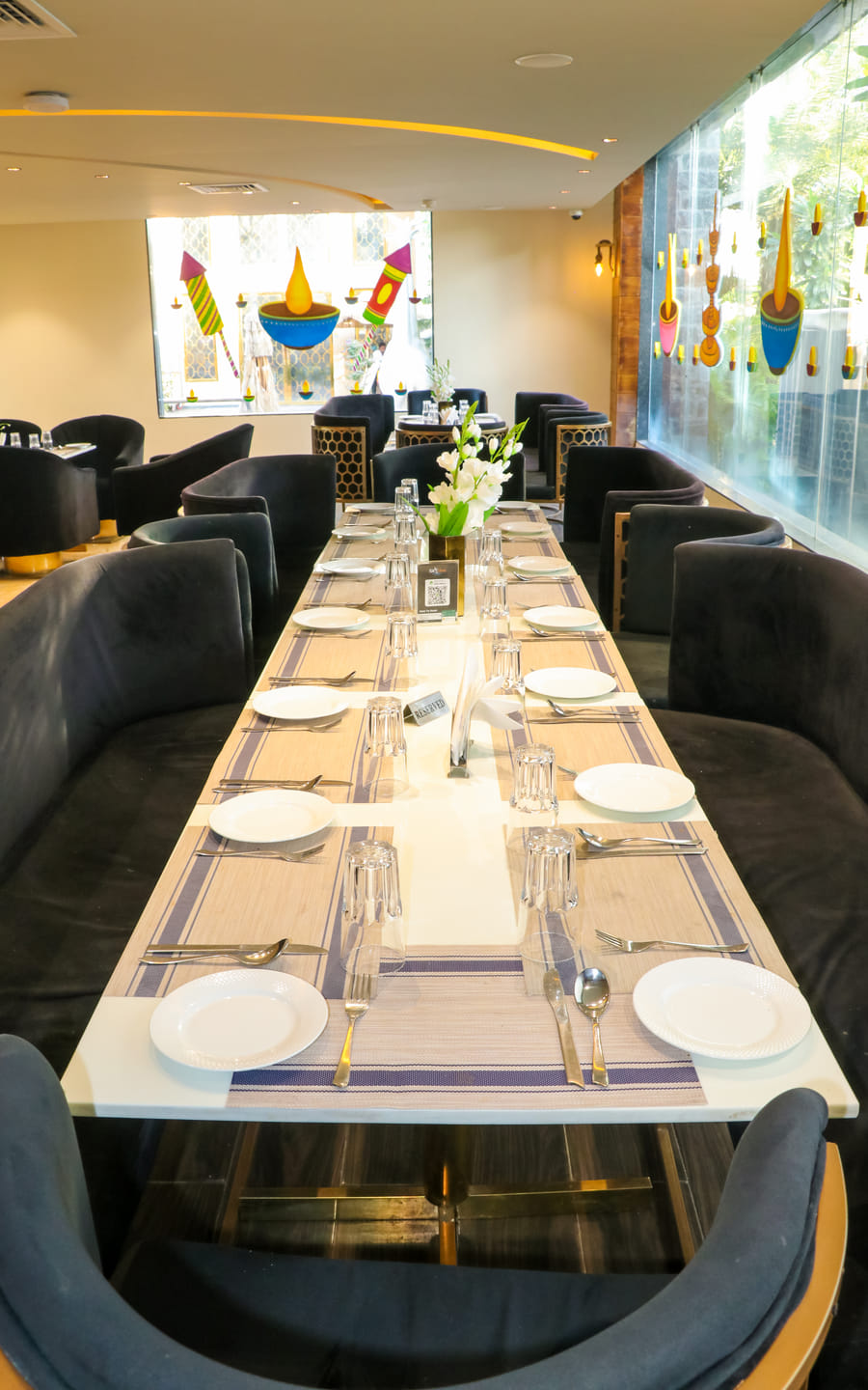 Miraya Dining, a long table laid at Zeus