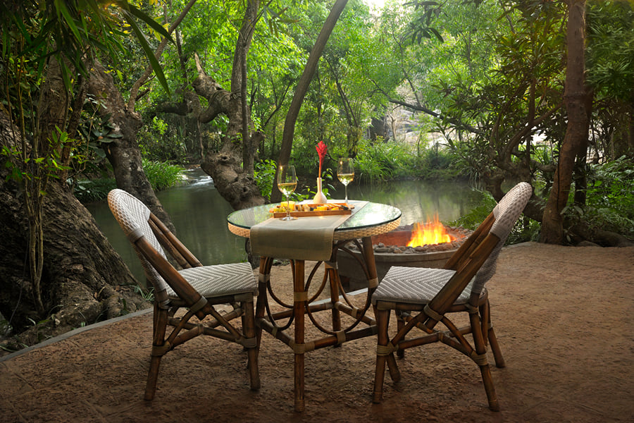 Riverside dining at the Rainbow Room, Amanvana Spa Resort, Kushalnagar