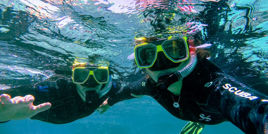 Two snorkellers underwater in the clear Andaman Sea near Port Blair