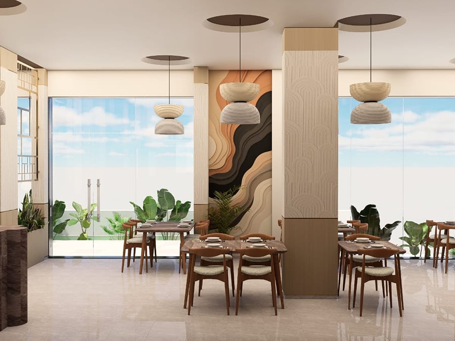 Bare wooden tables beneath woven pendant lights at Sea Shell Restaurant | Shirgaonkar Beach Resort