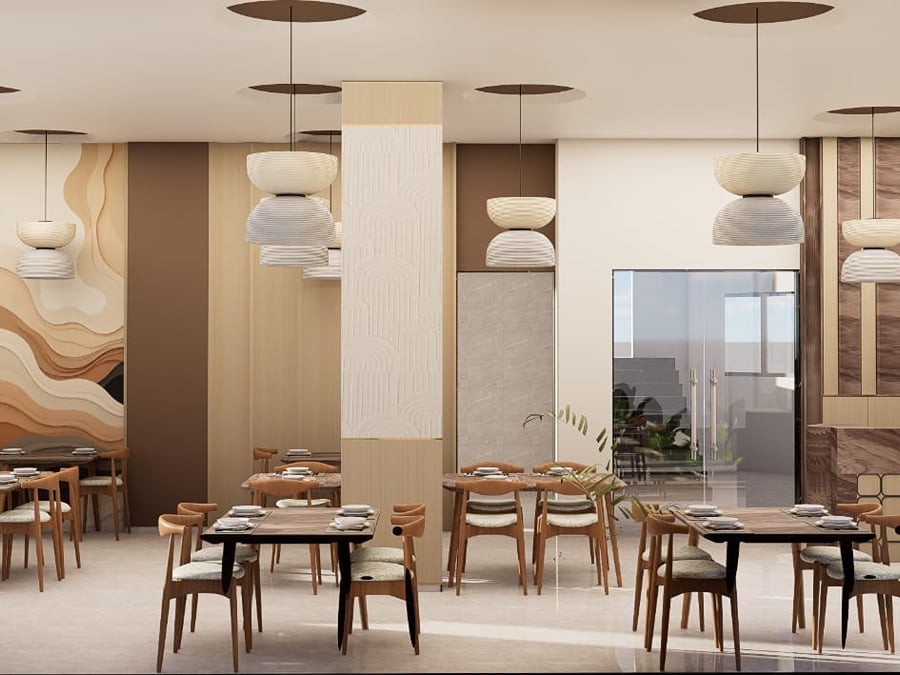Full-width view of the restaurant floor with tables laid for service | Shirgaonkar Beach Resort