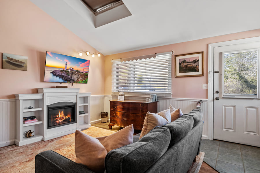 The sitting room with fireplace in the Normandy Suite at Hartstone Inn