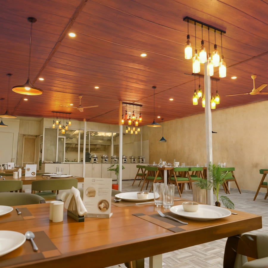 Buffet counter and dining area at Nazaara Nature Retreat's Fine Dine restaurant in Dalhousie, Himachal Pradesh.
