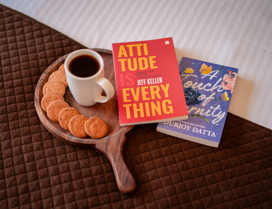 Tea and coffee tray with books arranged in the Superior Room at Nazaara Hills Retreat, Udaipur