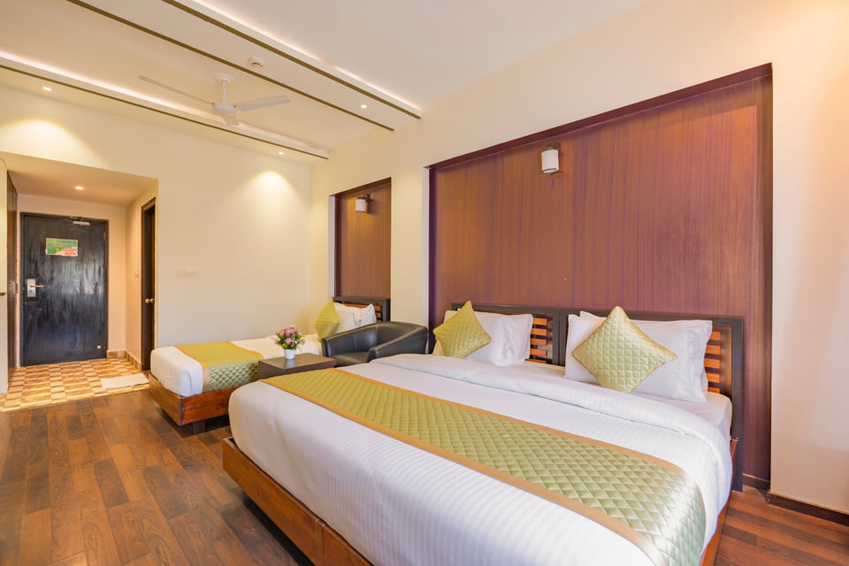 Executive Twin Room with two beds and a wood-panelled wall