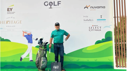 Man posing with a golf club at Heritage Village Golf tournament