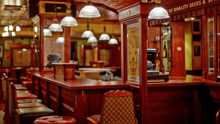 Classic Irish-themed pub interiors with wooden finishes, bar seating, and vintage-style lighting for relaxed evenings | Hablis Hotel Chennai