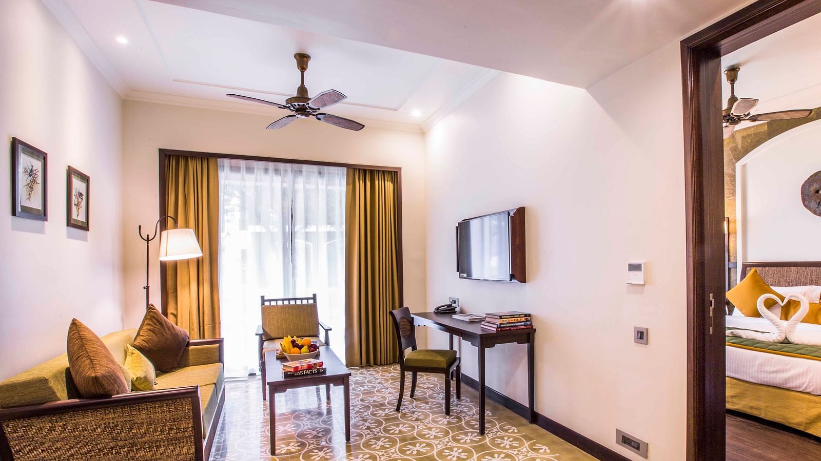 an image of a living room and a bedroom inside one of our rooms - Rhythm Lonavala