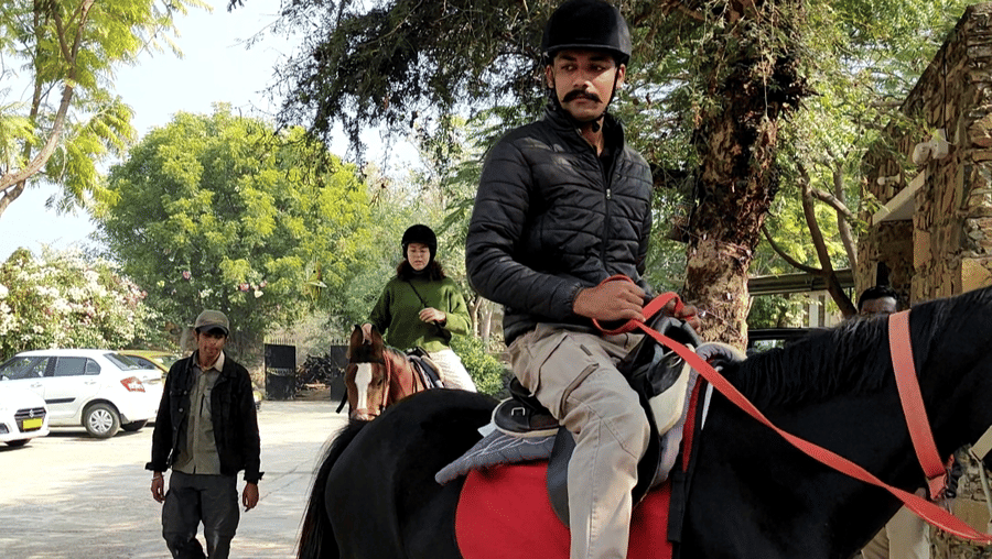An image of a man riding a horse - Utsav Camp Sariska